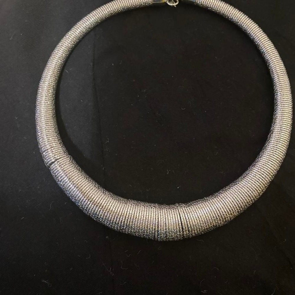Silvertone choker necklace with a unique design